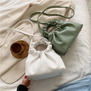 Fashionable green and white pleated bucket bags with cloud-shaped design and top handles