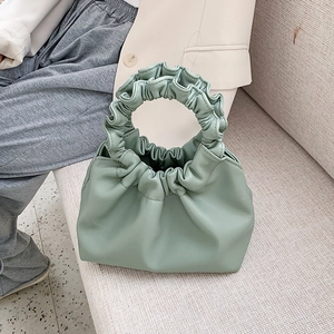 Modern mint green pleated cloud bucket bag with scrunchie handle and soft PU leather finish