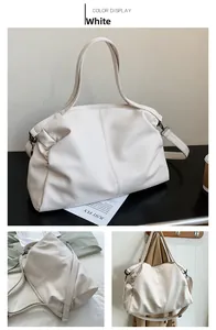 Detail of white large-capacity tote bag with pebbled PU leather and cross stitching