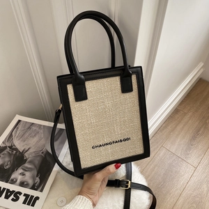 Fashionable beige woven and black leather contrast small square crossbody bag with strap