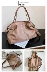 Detail view of khaki pebbled leather tote with dual handles and removable strap