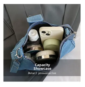 Internal view of blue denim shoulder bag showing spacious storage for daily essentials
