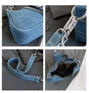 Detail view of denim handbag showing silver hardware, chain strap and interior pocket
