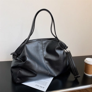 Large black pebbled leather tote bag for women with dual handles and wide shoulder strap