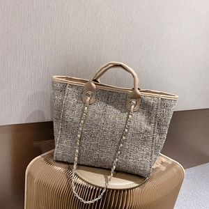Chic tweed bucket tote bag with leather handles and gold chain strap for women