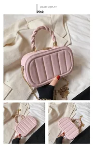 Detailed view of pink quilted handbag with gold chain and braided handle