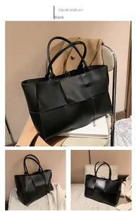 Détail de la texture en cuir tissé noir sur un grand sac cabas minimaliste pour femme