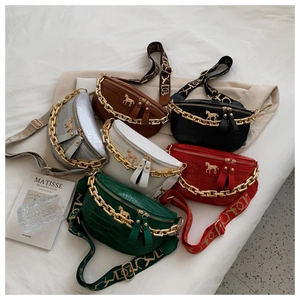 Multiple colorful crocodile pattern crossbody chest bags with thick gold chain detail