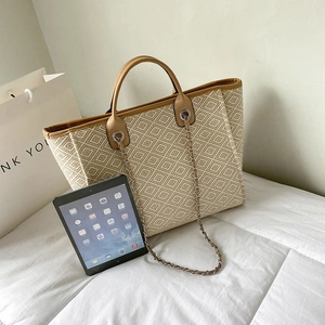 Ethnic style woven tote bag in beige and brown with chain strap for casual daily use
