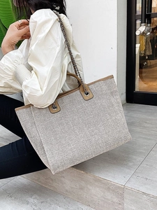 Women's large capacity bucket tote bag with woven fabric and brown leather trim