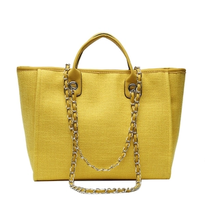 Chic yellow woven tote bag with silver chain straps and large capacity for women