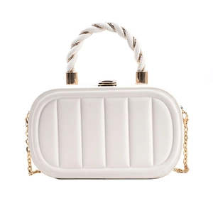 White quilted crossbody bag with golden chain strap and spiral leather handle