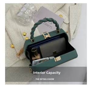 Top view of dark green box bag showing internal capacity for daily essentials