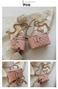 Detailed view of pink quilted camera bags with gold chain straps and camellia zip charms