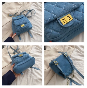 Detail of blue denim quilted mini backpack featuring gold chain straps and twist-lock