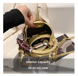 Detail view of yellow lychee leather bucket bag interior showing spacious capacity