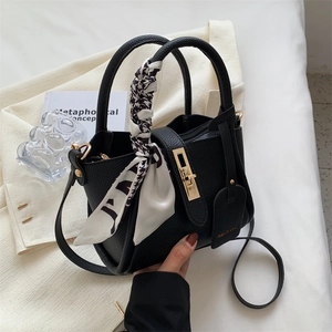 Chic black tote bag with lychee pattern faux leather and houndstooth scarf handle detail
