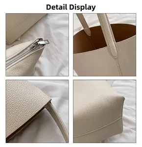 Detail view of cream lychee pattern leather tote bag with metal zipper and reinforced stitching