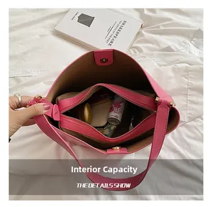 Macro view showing large capacity and multi-layer interior of this pink tote bag