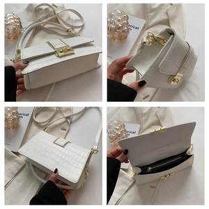 Detail shots of white crocodile pattern crossbody bag with gold fashion clasp and inner pocket