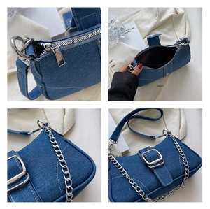 Dettagli della borsa in denim con cerniera, spazio interno e catena in metallo argentato