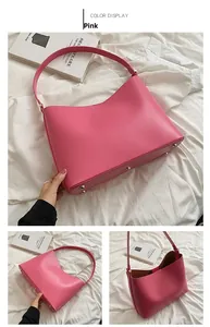 Pink matte leather hobo bag featuring protective gold-tone base studs and spacious interior