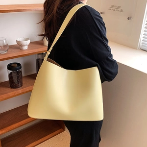 Minimalist large capacity faux leather tote bag in cream yellow for daily commuting