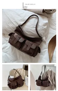 Detail of coffee-colored faux leather tote bag with two front pockets and long shoulder straps