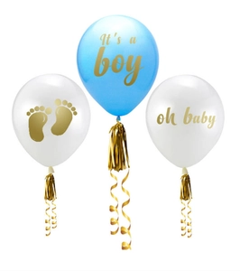 Close-up of It's a boy baby shower balloons with golden tassels and footprint patterns