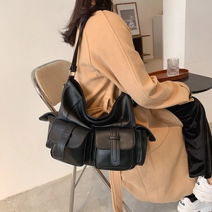 Black large capacity faux leather tote bag with multi-pocket workwear design