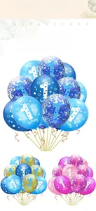 Detail of 1st birthday balloon sets in blue, gold and pink with confetti and star patterns