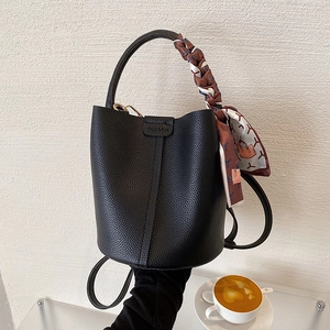 Litchi pattern black bucket bag with silk scarf handle and versatile crossbody strap