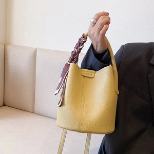 Yellow lychee pattern bucket bag with silk scarf handle and adjustable strap