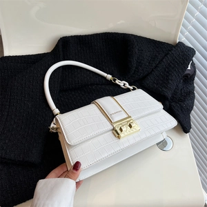 Chic white crocodile pattern crossbody bag with gold fashion lock on cream background