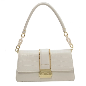Chic beige crocodile textured crossbody bag with gold fashion lock and chain strap