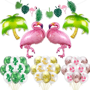 Tropical party decor kit featuring pink flamingo balloons, palm trees, and summer leaf banners