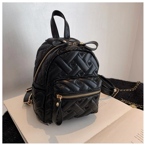 Black mini backpack for women featuring heart quilting and cute bow decoration