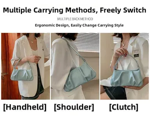 Three-way carry style of light blue pleated cloud bag for handheld, shoulder or clutch use