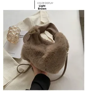 Close-up of light coffee faux fur handbag featuring soft plush texture and gold chain strap