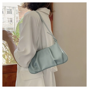 Light blue pleated cloud bag featuring soft PU leather texture and thin shoulder strap