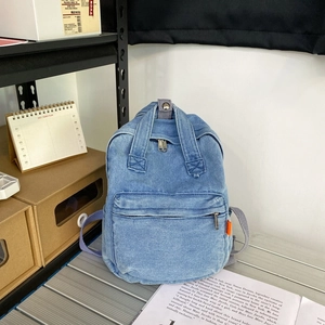 Stylish light blue denim mini backpack with front zipper pocket for casual daily use