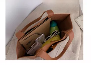 Interior view showing the large capacity and leather texture of this brown tote bag