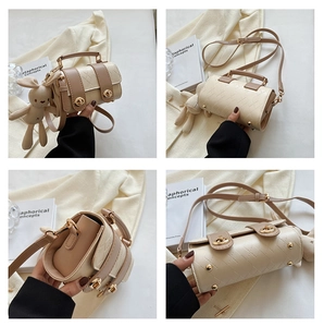 Detailed views of a quilted bicolor Boston bag with golden hardware and rabbit charm