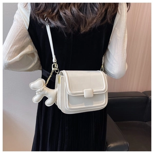 White PU leather crossbody bag with matching square buckle and cute dog charm detail