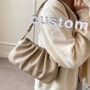 Minimalist beige ruched shoulder bag with cloud-like pleats and slim strap for women