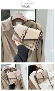 Detailed side view of khaki crossbody bag showing triple-layer accordion structure