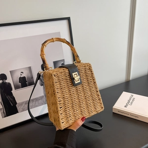 Square straw woven bag with bamboo handles and golden twist lock clasp for women