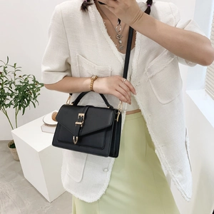 Classic black rectangular flap bag with gold horsebit buckle and top handle for women