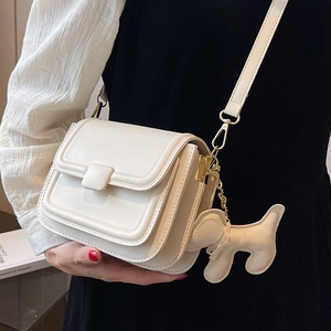 Chic beige crossbody square bag with cute dog charm and adjustable strap for women