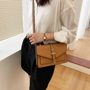 Stylish tan leather crossbody square bag for women with gold buckle and adjustable strap